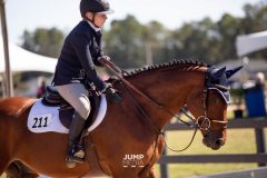 Megan patting Dior after a jumper round